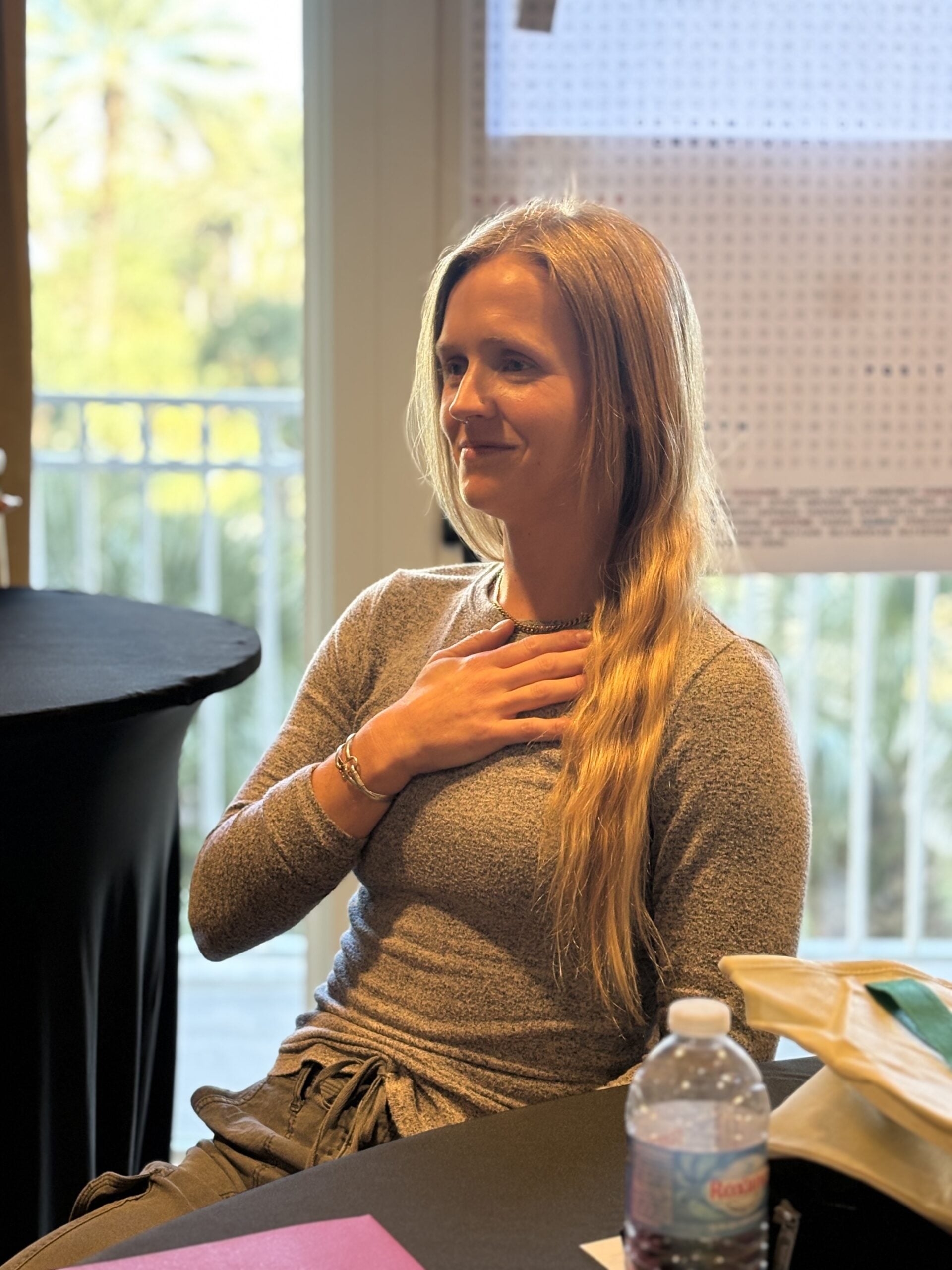 A retreat participant choosing a quiet embodied way to engage